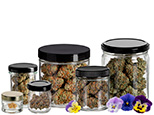 Browse glass and tin cannabis containers.